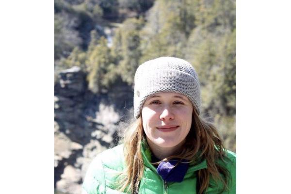 Rachel Coyte in a winter hat and green coat 
