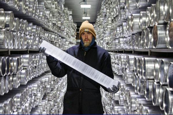 A man in winter gear standing in an indoor facility holding an ice core with text and NSF and US SCAR.logo: text says Live: What Polar ice cores tell us about our climate When: Thursday, January 18, 2024 More information and registration: https://bit.ly/icf-social