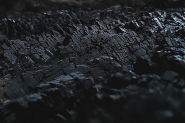 Close-up  of a rock formation like coal. 