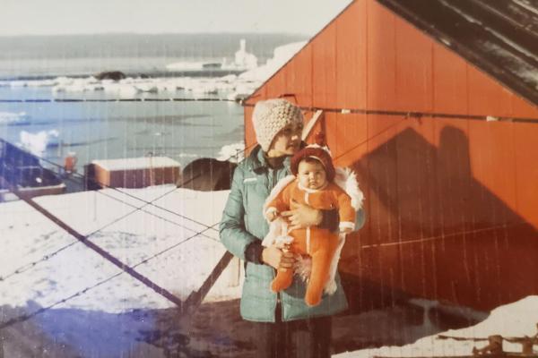 Portrait of a women holding a baby in the Antartic