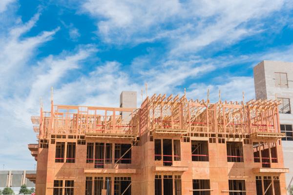 Wooden apartment building under construction.