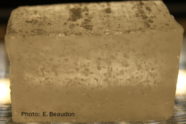 A block of ancient, dirty ice with particles of dust in it.