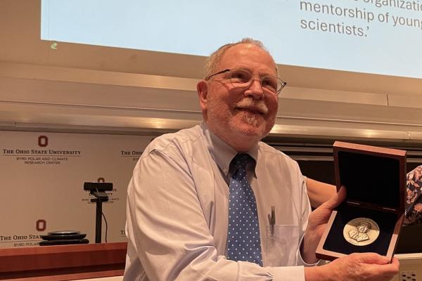 Berry Lyons Receiving an award.