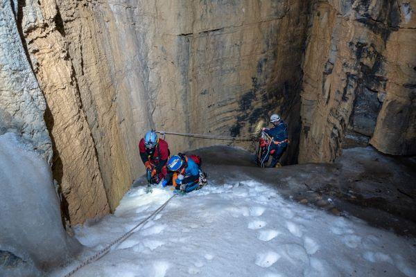 Researchers collect an ice sample in a cave in Great Basin National Park.