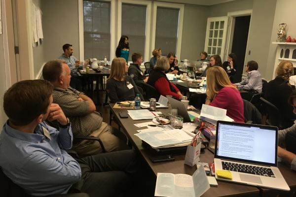 People having a discussion at a round table