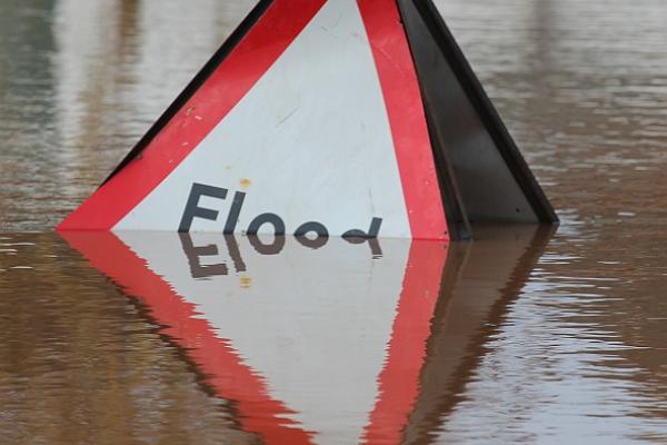 "Flood" sign in water