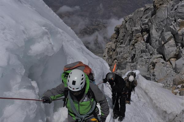 Climbing Huascaran Three mountaineers climbing on ice