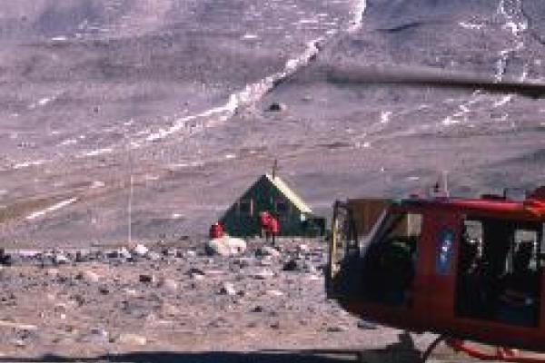 Valley with helicopter and shelter