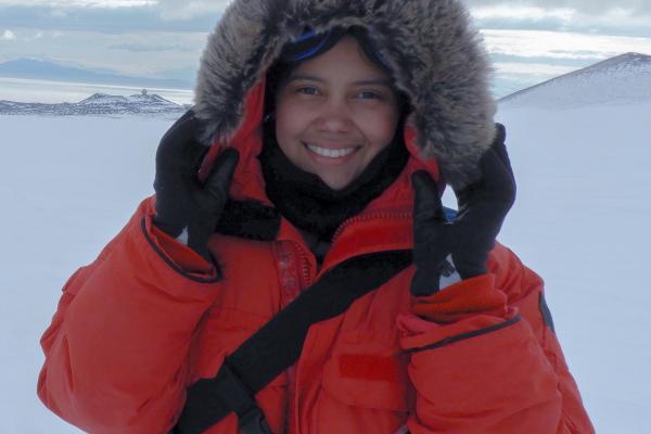 Melisa Diaz Woman in fur-lined coat with ice sheet backdrop