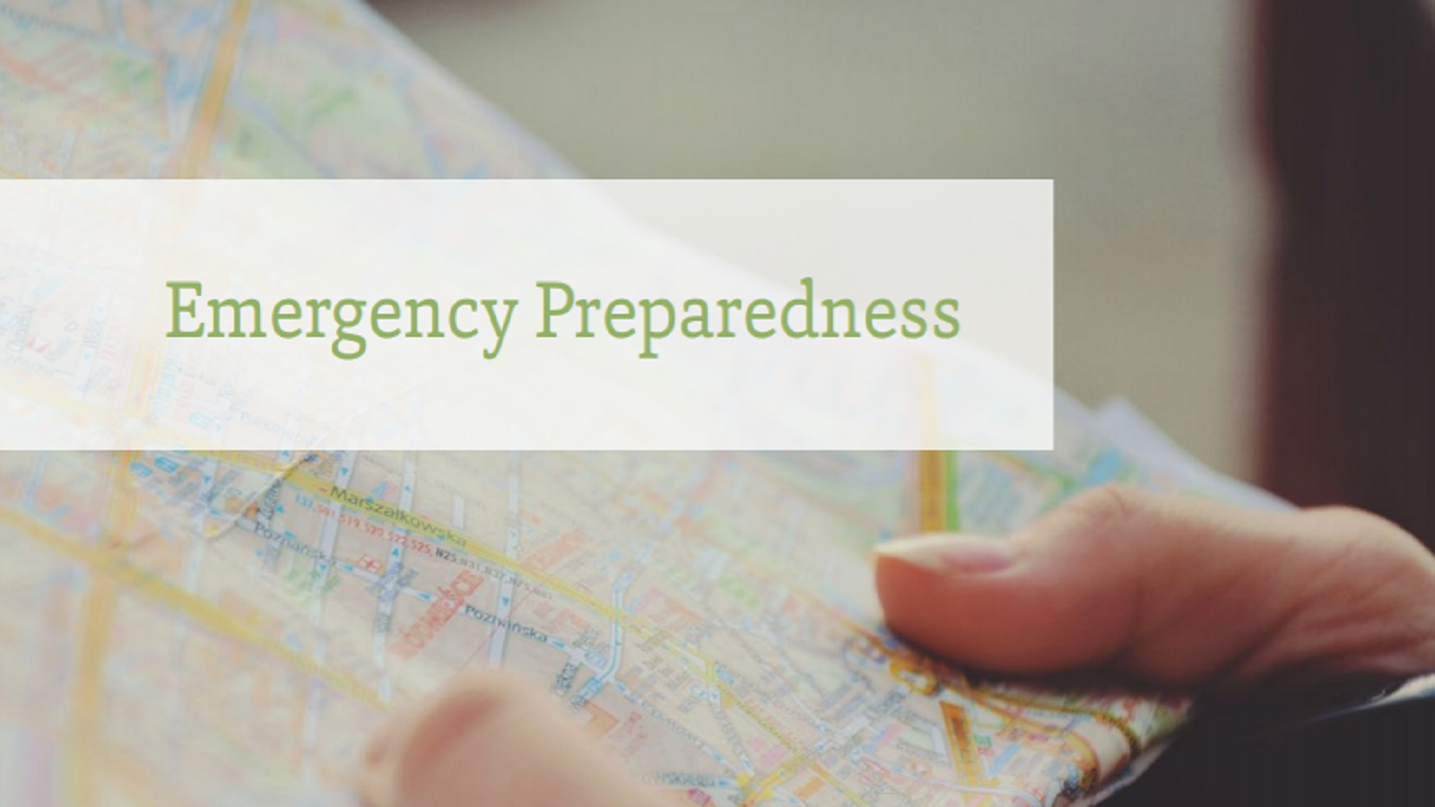two hands holding a map with text that reads 'Emergency Preparedness'