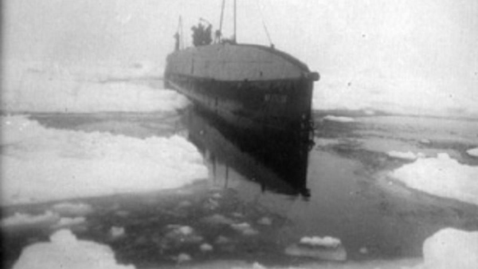 Black and white photo of Nautilus Submarine traveling through sea ice