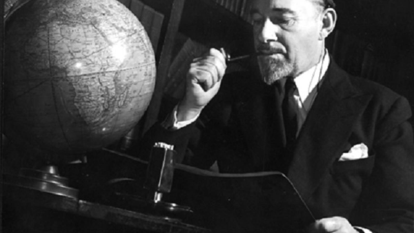 Wilkins observing a globe