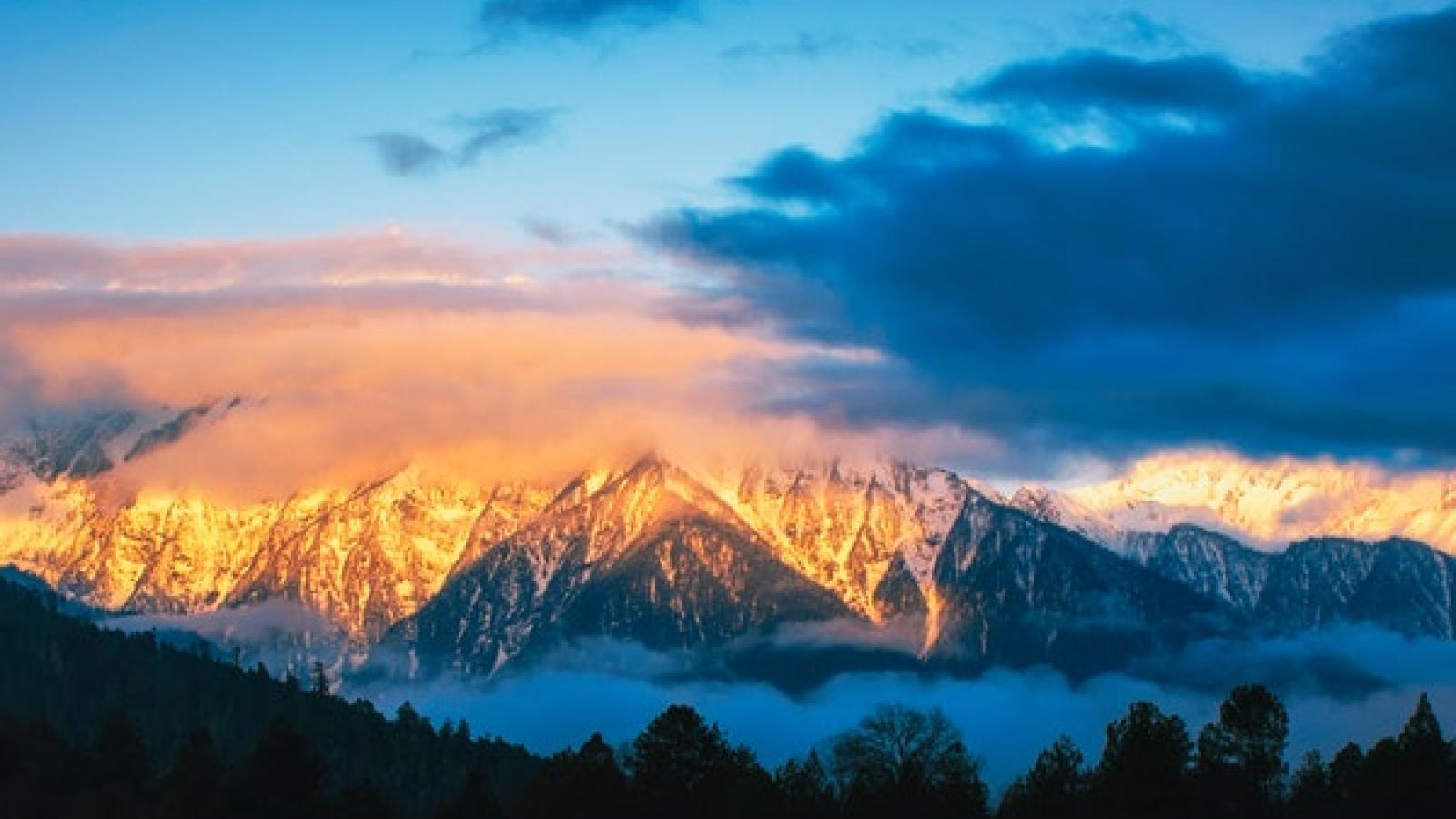 snow covered Mountains and blue skies in sunrise