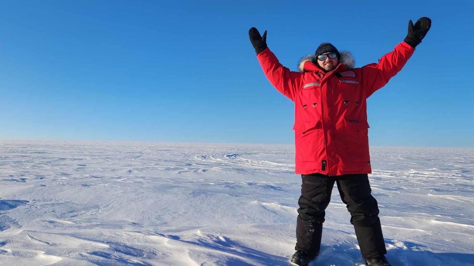 Posing on the summit of the Devon Island ice cap in the Canadian High Arctic