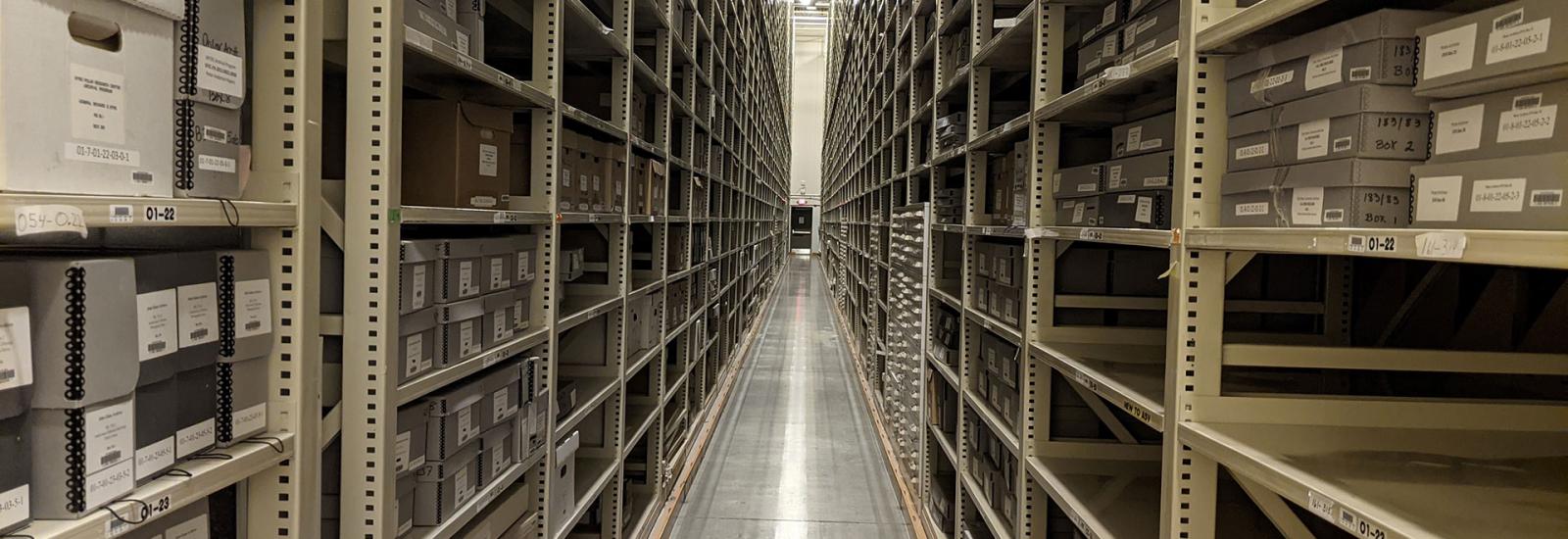 Long hallway filled with shelves of archives on both sides.