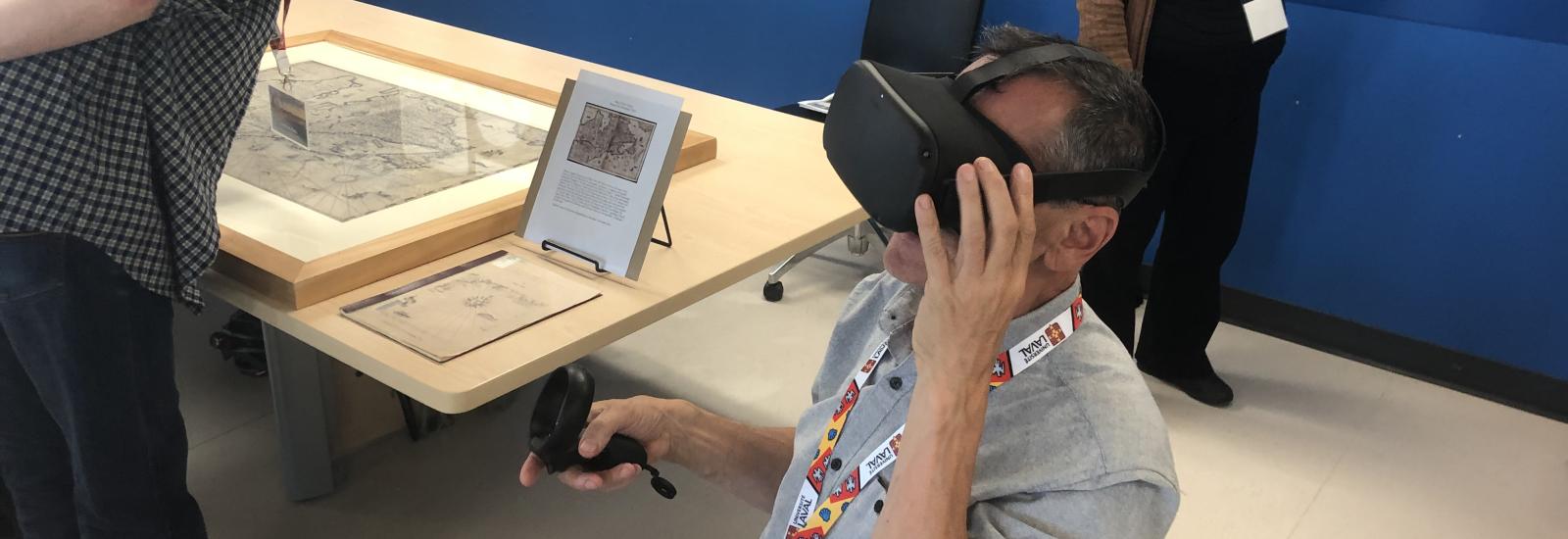 man in a light gray shirt using a VR headset