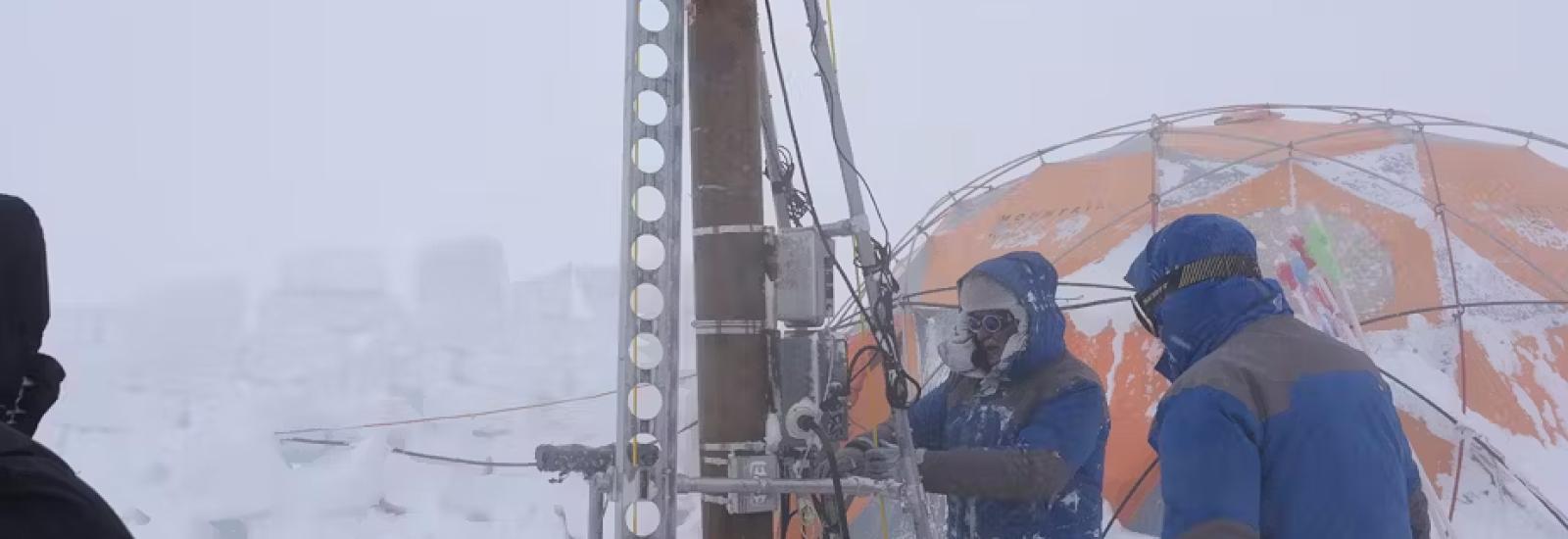 Scientist drilling in the Antarctic 