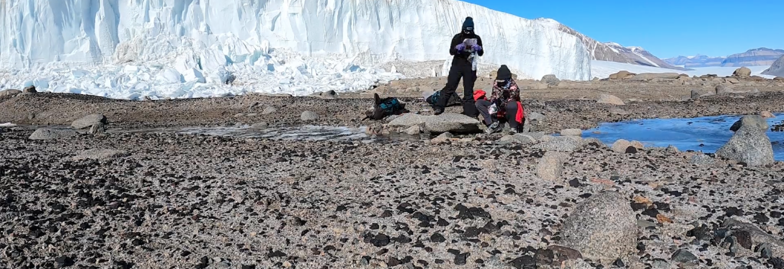 Two researchers gathering water samples