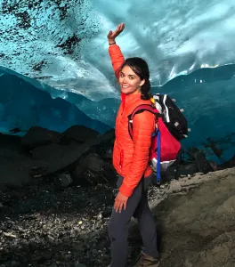 Michalea King poses for a photo in front of a mountain range 