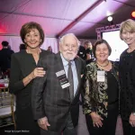 From Left to right, Tina Skestos, George Skestos, Georgie Shockey, President Kristina Johnson  and  Catherine Baumgardner posing for the camera in a banquet hall