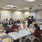 A group seated having lunch.