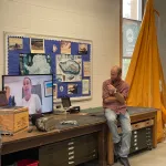 Jamey Stutz sitting on a table.