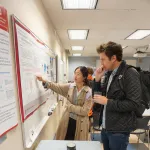 People talking during poster session.