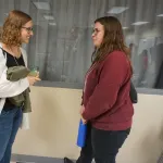 People talking during poster session.
