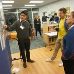 People talking during poster session.