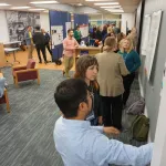 People talking during poster session.