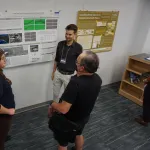 People talking during poster session.