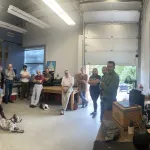 Participants sitting and standing at the Polar Rock Repository. 