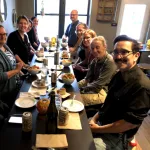 A group at dinner in a restaurant.