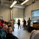 Participants sitting and standing at the Polar Rock Repository. 