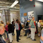 Participants sitting and standing at the Polar Rock Repository. 