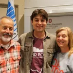 Three people smiling in front of The Ohio State University and Byrd Polar and Climate Research Center banners.