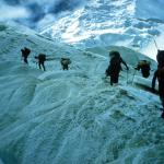 Researchers trek across Himalayan ridge-line.